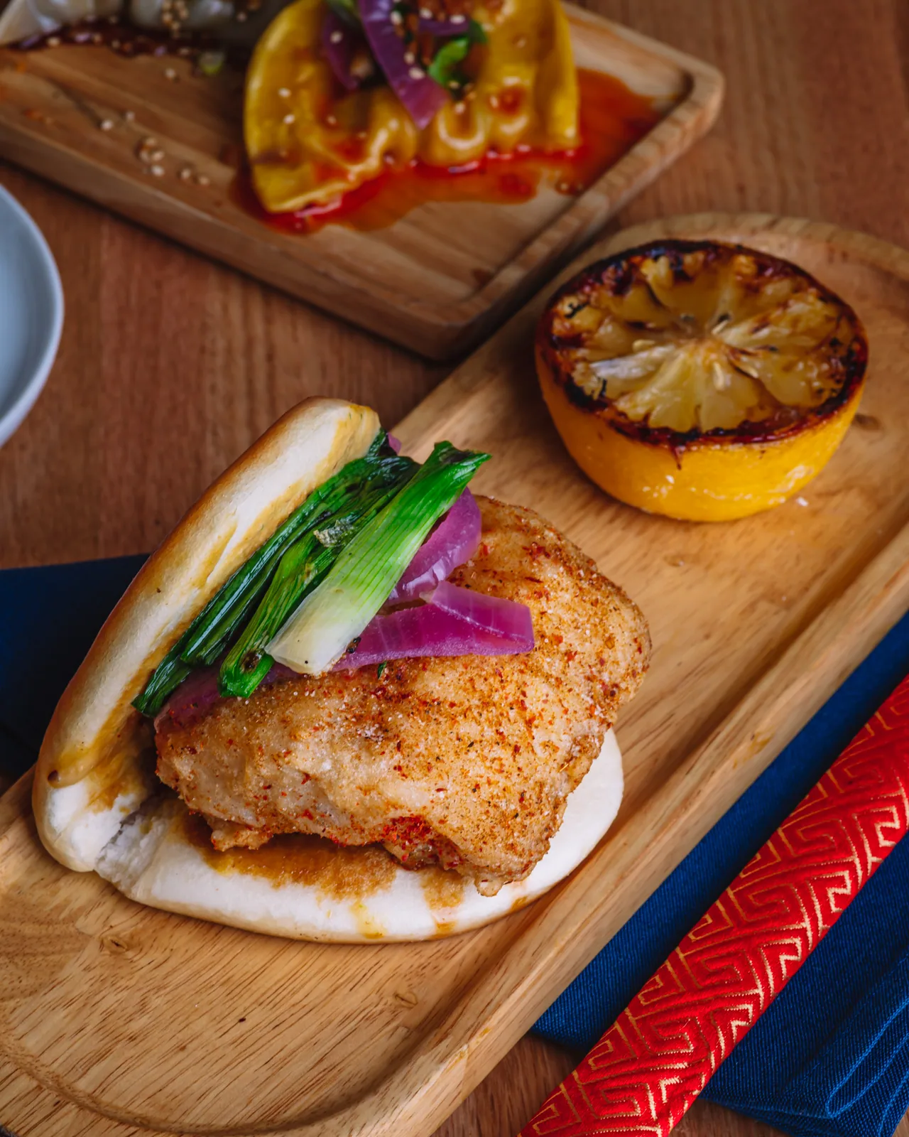 A grilled skewer with vegetables on a wooden board