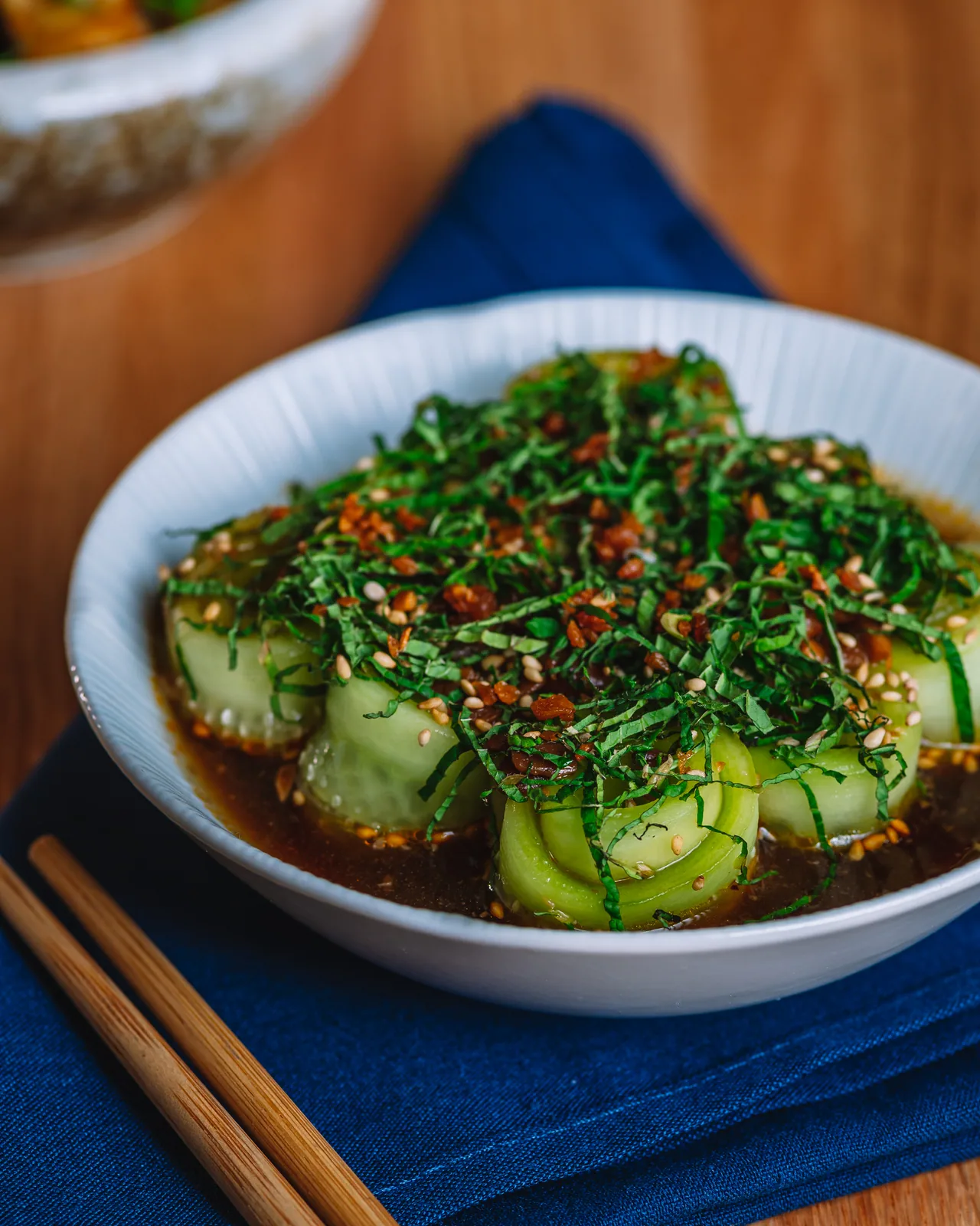 Cucumber pieces topped with herbs and red seasoning