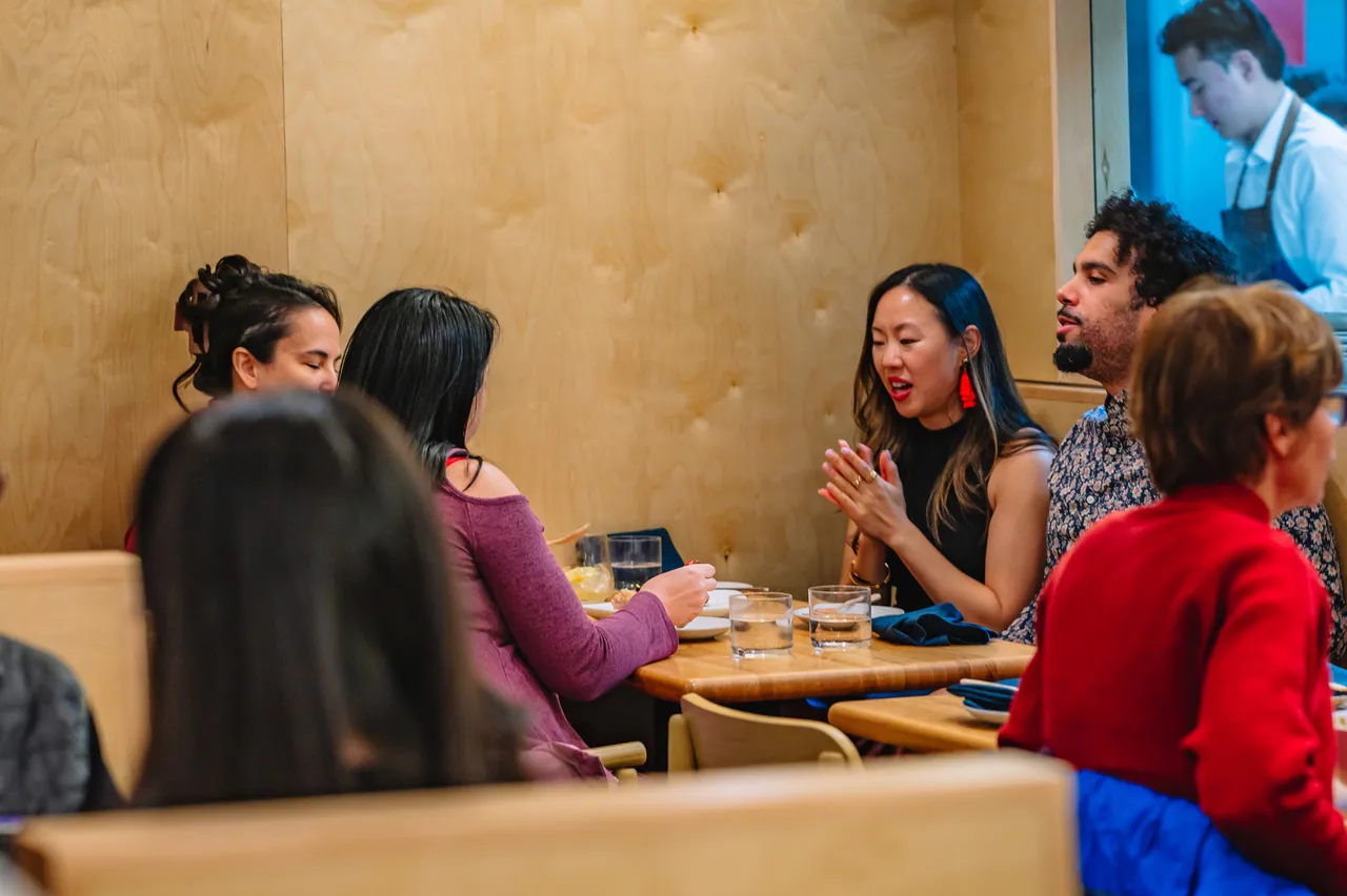 Guests gathered around a table in the Pentagon City dining room