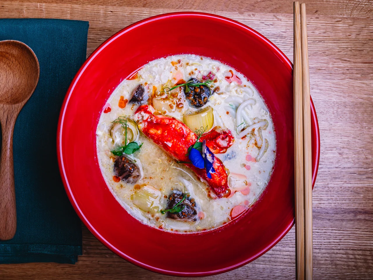 Overhead photograph of King Crab Mixian in a red bowl