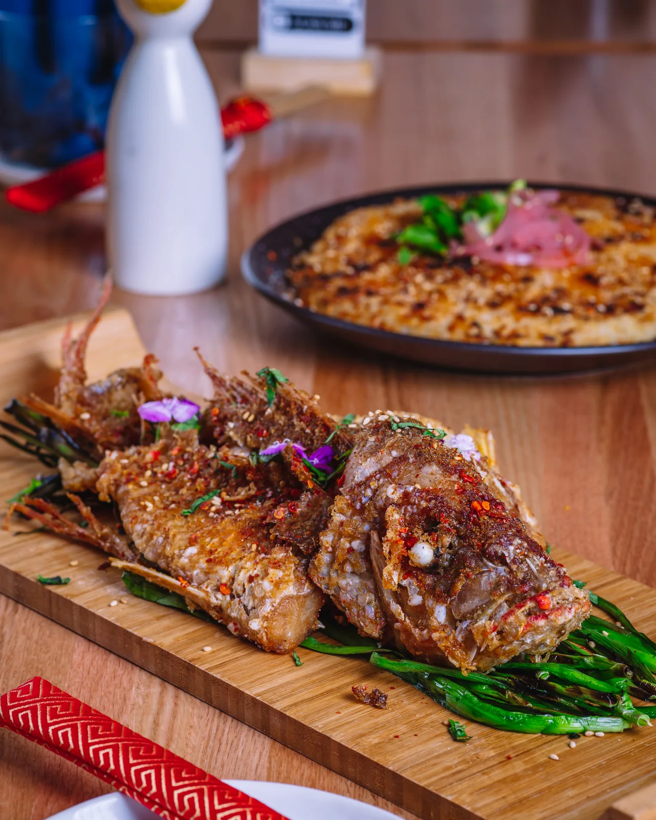 A large roasted meat platter served with greens